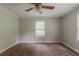 Bedroom with ceiling fan, neutral color palette, carpet and natural light at 2465 Hogan Rd, Atlanta, GA 30344