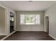 Inviting dining room filled with natural light from a large window and wood flooring at 2465 Hogan Rd, Atlanta, GA 30344