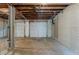 Spacious garage with two white garage doors and unfinished ceiling at 2465 Hogan Rd, Atlanta, GA 30344