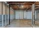 Spacious garage with two white garage doors and unfinished ceiling at 2465 Hogan Rd, Atlanta, GA 30344