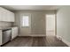 Eat-in kitchen providing stainless appliances and access to another room at 2465 Hogan Rd, Atlanta, GA 30344