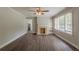 Cozy living room with fireplace, built-in shelving, and new flooring at 2465 Hogan Rd, Atlanta, GA 30344