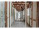 Unfinished room featuring exposed framing and a window at 2465 Hogan Rd, Atlanta, GA 30344