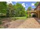 Spacious backyard with deck and mature trees at 6857 Womack Ct, Atlanta, GA 30360