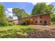 Home exterior and large backyard with deck perfect for outdoor entertaining at 6857 Womack Ct, Atlanta, GA 30360
