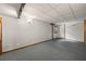 Spacious basement area with carpeted flooring and clean, bright walls at 6857 Womack Ct, Atlanta, GA 30360