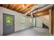 Finished basement includes walkout door, two windows, and painted brick walls at 6857 Womack Ct, Atlanta, GA 30360