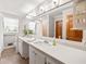 Bright bathroom with double vanity, tile floors, and separate shower area at 6857 Womack Ct, Atlanta, GA 30360