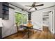 Charming breakfast nook featuring a bright window, built-in shelves, and modern ceiling fan for relaxed dining at 6857 Womack Ct, Atlanta, GA 30360
