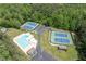 Aerial view of community featuring a large pool, tennis courts, and ample parking, perfect for active residents at 6857 Womack Ct, Atlanta, GA 30360