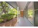 Spacious covered porch showcases exterior with views of the landscaped yard at 6857 Womack Ct, Atlanta, GA 30360