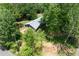 An elevated view showcases the well-maintained roof and landscaping surrounding the beautiful brick home at 6857 Womack Ct, Atlanta, GA 30360
