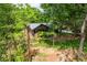 A secluded brick home surrounded by lush greenery, offering a peaceful and private setting at 6857 Womack Ct, Atlanta, GA 30360