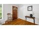 Warm and inviting foyer with hardwood floors and a decorative table at 6857 Womack Ct, Atlanta, GA 30360