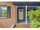 Inviting front door with sidelights and classic architectural details at 6857 Womack Ct, Atlanta, GA 30360