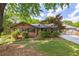 Charming brick home with a manicured front lawn and mature trees at 6857 Womack Ct, Atlanta, GA 30360