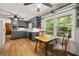 Updated eat-in kitchen with gray cabinetry, stainless appliances, and a breakfast nook with lots of natural light at 6857 Womack Ct, Atlanta, GA 30360