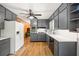 Spacious kitchen featuring gray cabinets, stainless steel appliances, and a bright, airy atmosphere at 6857 Womack Ct, Atlanta, GA 30360
