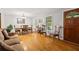 Open concept living room and dining area with hardwood floors and natural light at 6857 Womack Ct, Atlanta, GA 30360