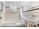 Functional bathroom features a tub-shower combo and bright natural light at 1861 Ardmore Nw Rd, Atlanta, GA 30309