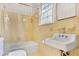 This retro bathroom has a tub-shower, patterned tile, and a window at 1861 Ardmore Nw Rd, Atlanta, GA 30309