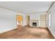 Bright living room features hardwood floors, fireplace, and built-in shelves at 1861 Ardmore Nw Rd, Atlanta, GA 30309
