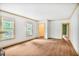 Bright living room with hardwood floors and large windows, offering ample natural light at 1861 Ardmore Nw Rd, Atlanta, GA 30309