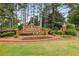 Attractive brick entrance to the Cambridge community with lush landscaping at 205 Devon Downs Pl, Alpharetta, GA 30005