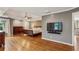 Spacious main bedroom boasts hardwood floors, decorative wallpaper, ceiling fan, and natural light at 205 Devon Downs Pl, Alpharetta, GA 30005