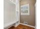 Bright mudroom features wood floors, built-in cubbies, and storage, a practical entryway for the home at 205 Devon Downs Pl, Alpharetta, GA 30005