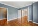 Well-lit office space boasting hardwood floors, French doors, and a calming color scheme at 205 Devon Downs Pl, Alpharetta, GA 30005