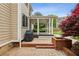 Side patio with a grill and beautiful red maple tree, creating an ideal outdoor cooking and dining area at 205 Devon Downs Pl, Alpharetta, GA 30005