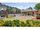 Community tennis courts and covered seating offer recreational opportunities for residents at 205 Devon Downs Pl, Alpharetta, GA 30005