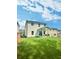 The backyard with a well-maintained lawn and a covered patio for outdoor enjoyment at 283 Wells Cir, Canton, GA 30114