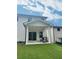 View of the backyard patio with string lights, seating, and manicured lawn at 283 Wells Cir, Canton, GA 30114