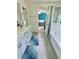 Bathroom with a double vanity, shower, and view into an adjacent bedroom at 283 Wells Cir, Canton, GA 30114