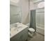Modern bathroom with a large mirror, vanity, and shower-tub combination at 283 Wells Cir, Canton, GA 30114