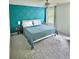 Bedroom featuring a blue accent wall, plush carpeting, and a comfortable bed at 283 Wells Cir, Canton, GA 30114