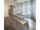 Well-lit dining room featuring modern table set with hardwood floors and ample natural light at 283 Wells Cir, Canton, GA 30114