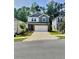 Charming two-story home with a brick and siding exterior and a two-car garage at 283 Wells Cir, Canton, GA 30114