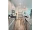 Spacious kitchen with granite countertops, stainless steel appliances, and wood flooring at 283 Wells Cir, Canton, GA 30114