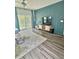 Well-lit living room with decorative textured wall, hardwood floors, and modern furniture at 283 Wells Cir, Canton, GA 30114