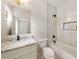 Bathroom featuring a shower-tub combination with white marble tile and a dark shower head at 3006 Skyland Ne Dr, Brookhaven, GA 30319