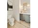 Elegant powder room featuring a unique mirror, stylish vanity with marble countertop, and modern fixtures at 3006 Skyland Ne Dr, Brookhaven, GA 30319
