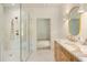 Bathroom featuring a glass-enclosed shower and marble countertop vanity with gold fixtures at 3006 Skyland Ne Dr, Brookhaven, GA 30319