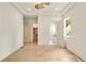 Bright bedroom with ensuite bath and walk-in closet, hardwood floors, and modern lighting at 3006 Skyland Ne Dr, Brookhaven, GA 30319