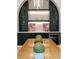 Close up of dining room featuring custom built-in cabinets with glass shelving and a beverage fridge at 3006 Skyland Ne Dr, Brookhaven, GA 30319