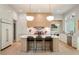 Modern kitchen boasts a center island with seating and stylish pendant lighting at 3006 Skyland Ne Dr, Brookhaven, GA 30319