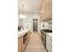 Bright, open kitchen with a large island, stainless steel appliances, and hardwood floors at 3006 Skyland Ne Dr, Brookhaven, GA 30319