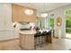 Well-lit kitchen with an island, stainless steel appliances, and access to outdoor space at 3006 Skyland Ne Dr, Brookhaven, GA 30319